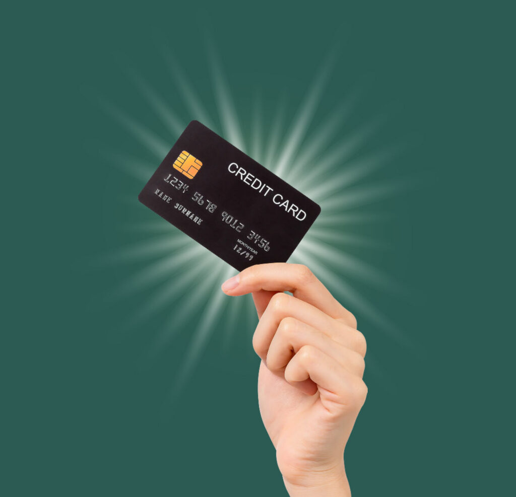 Photo of a hand holding a credit card